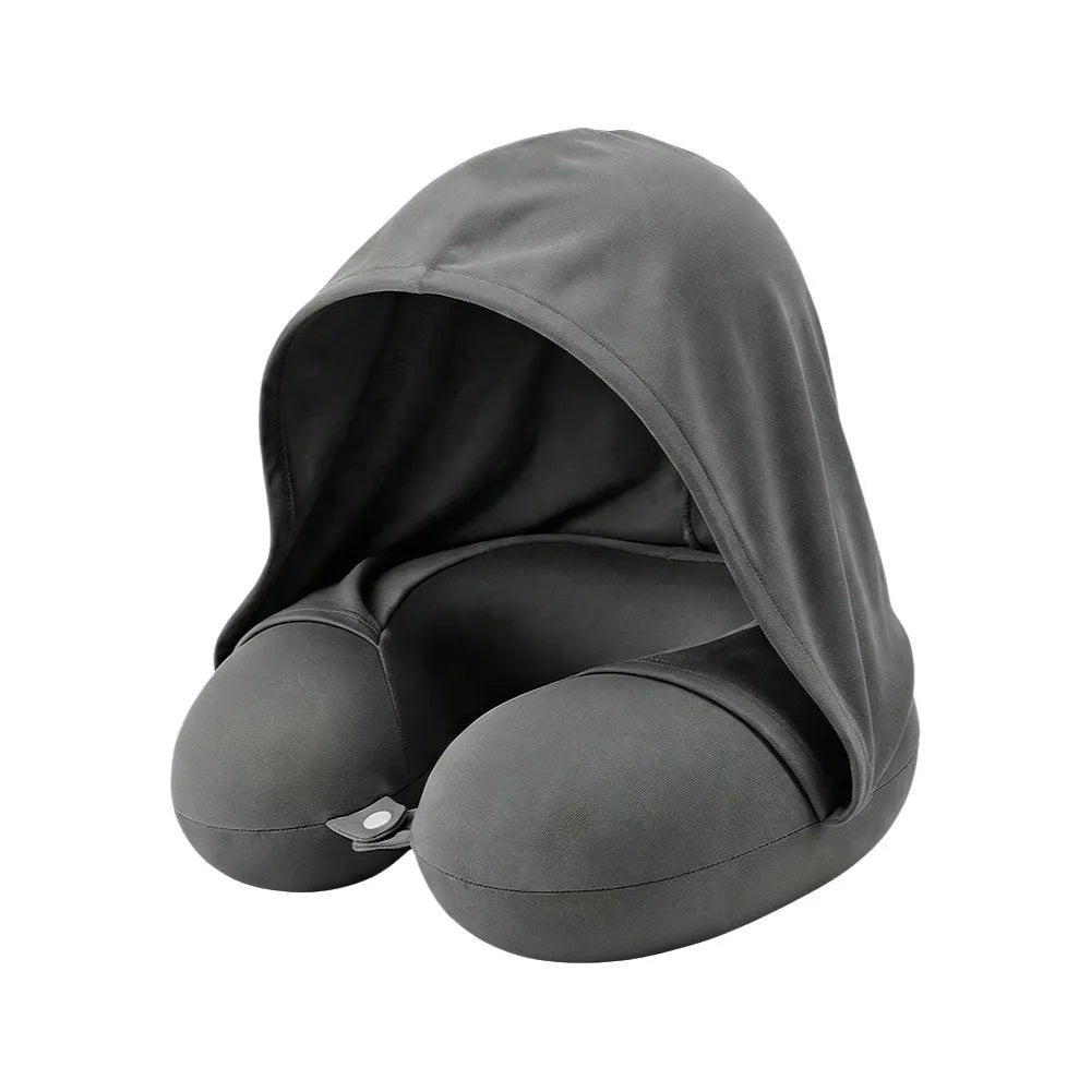 Grey U-shaped travel pillow with attached hood on a white background