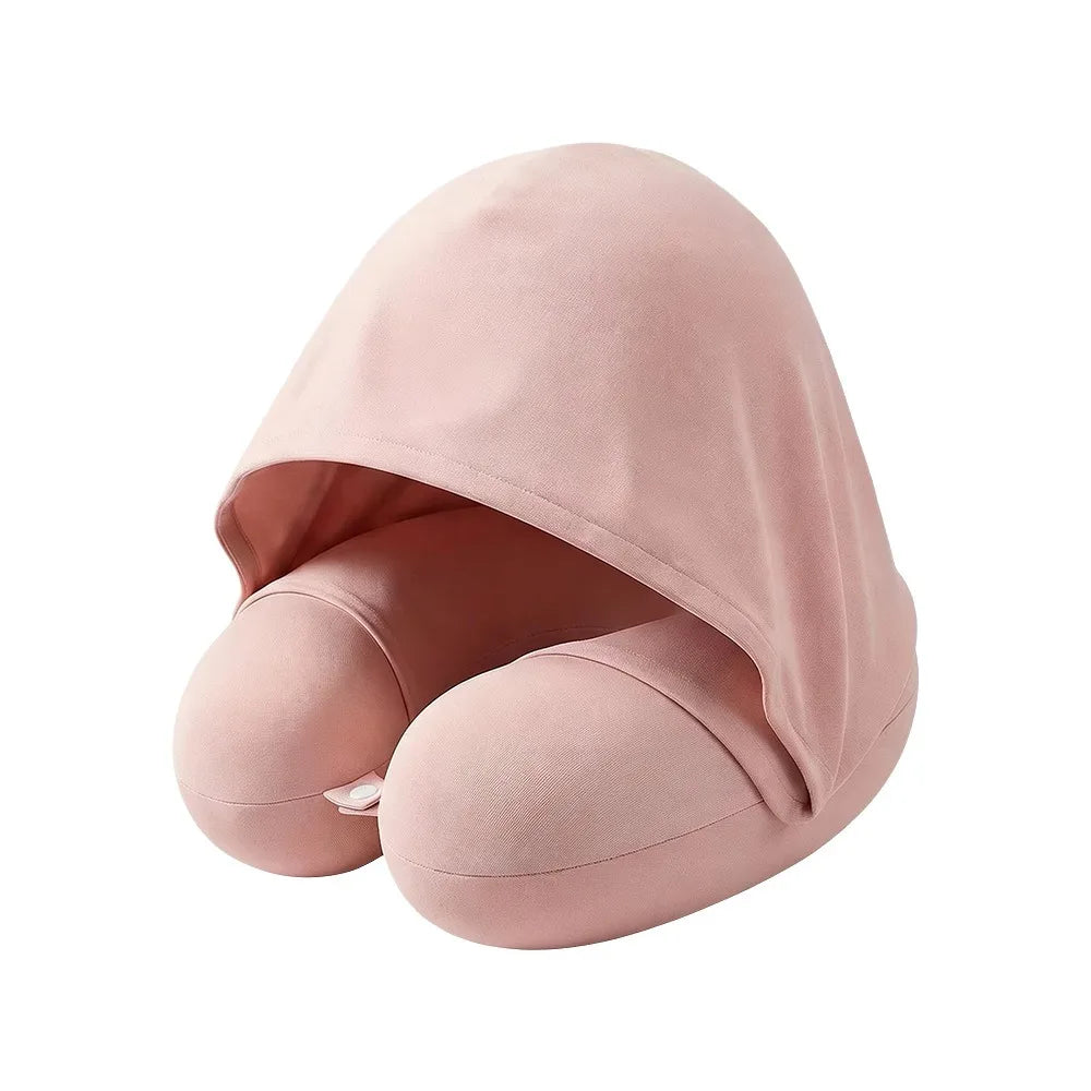Pink U-shaped travel pillow with attached hood