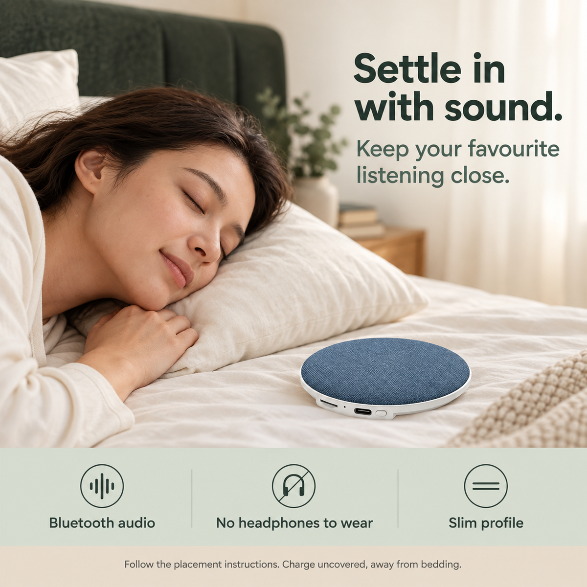 Woman resting beside a blue pillow speaker on cream bedding, with Bluetooth audio and slim profile features.
